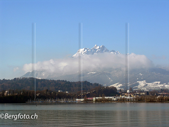Foto: Pilatus und Vierwaldstättersee bei Luzern. Der Gipfel des Pilatus ragt aus dem Wolkenband.