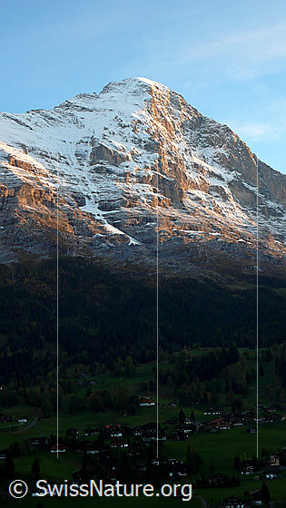 Foto: Eigernordwand im Abendlicht. Die Chalets von Grindelwald liegen bereits im Schatten.
