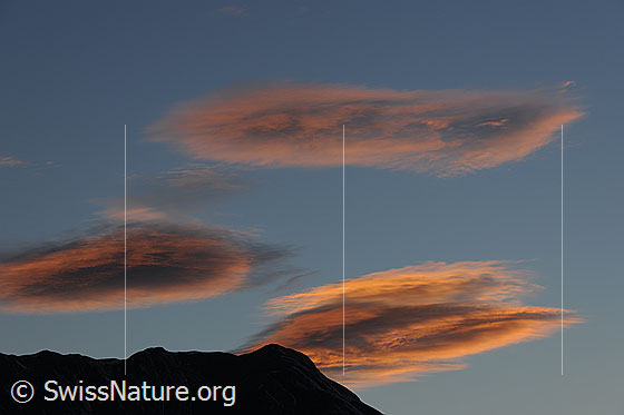 Foto: Abend: Rötliche Wolken über der Silhouette des Breithorns.