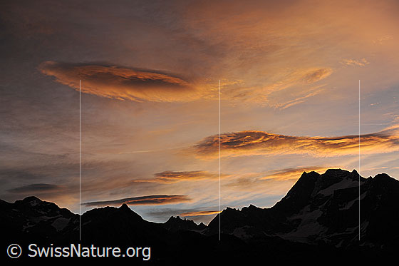 Foto: Morgenstimmung über dem Ofenhorn. Farbige Wolkenbilder zieren den Morgenhimmel.